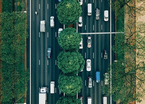 Aerial view of vehicles traveling across a multi-lane road